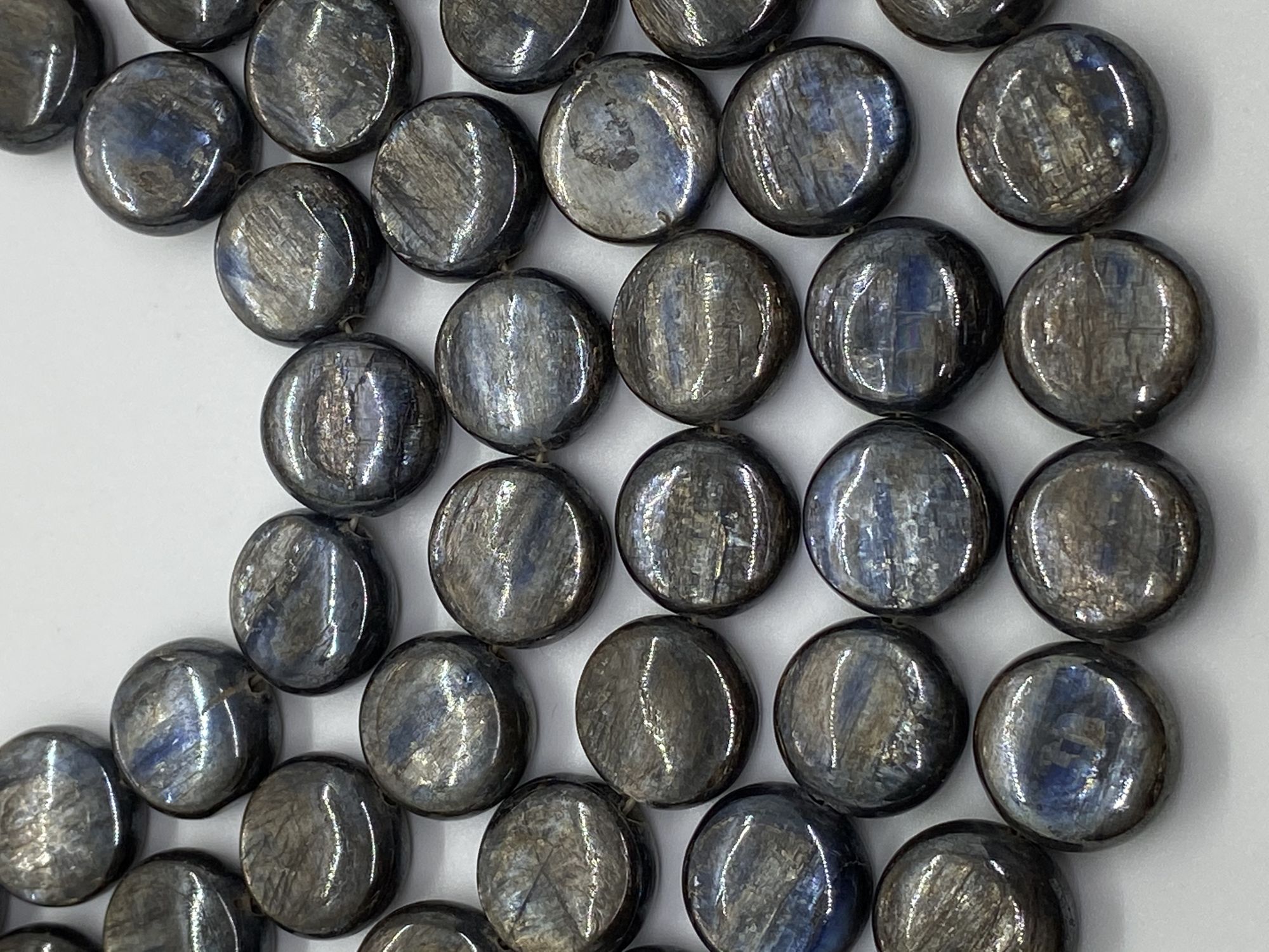 Coated Kyanite Coin Smooth