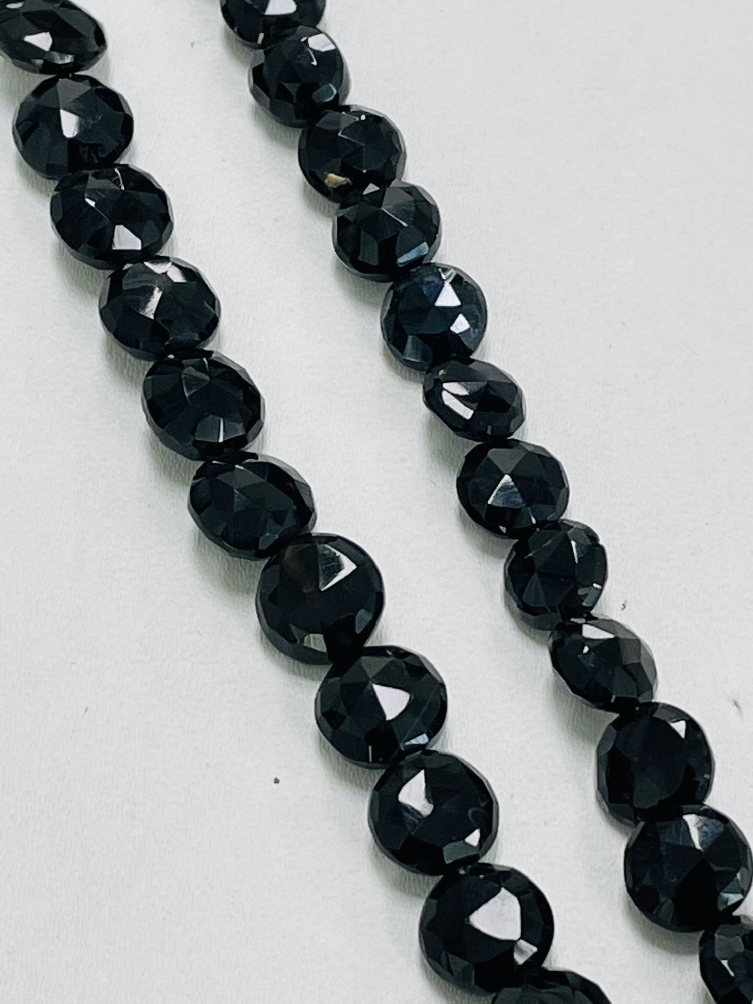 Black Spinel Coin Faceted