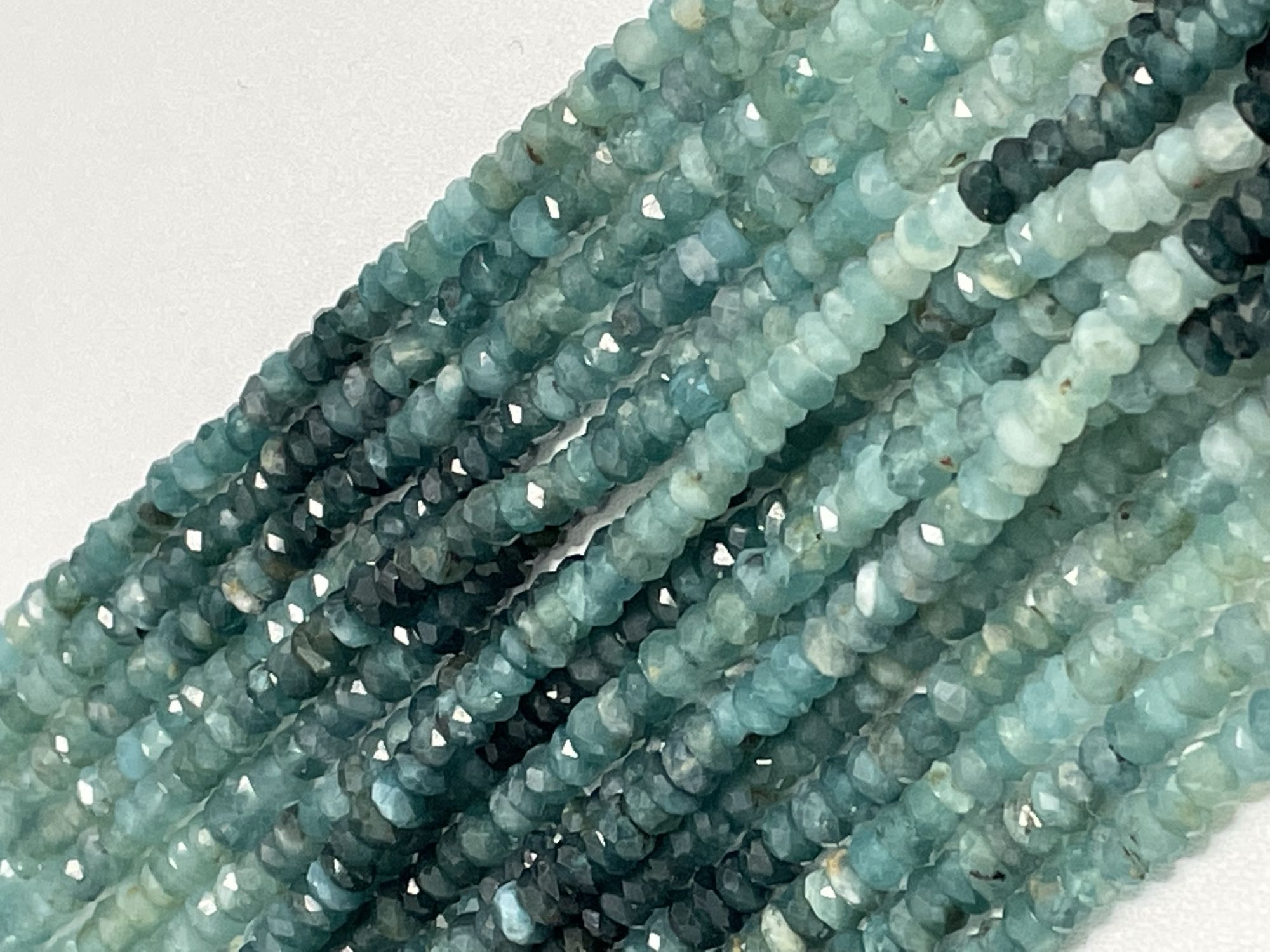 Shaeded Grandidierite Rondelle Faceted