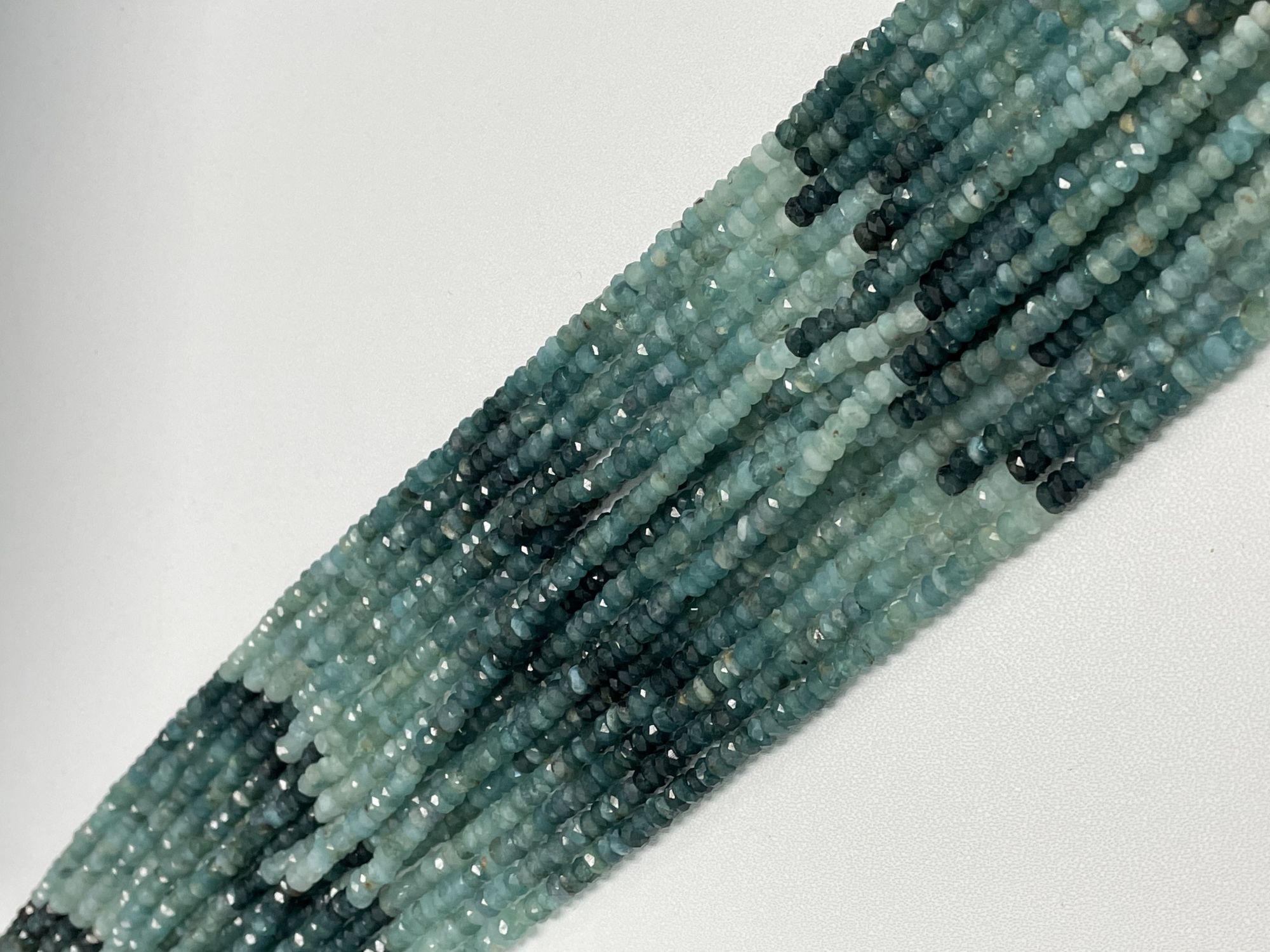 Shaeded Grandidierite Rondelle Faceted