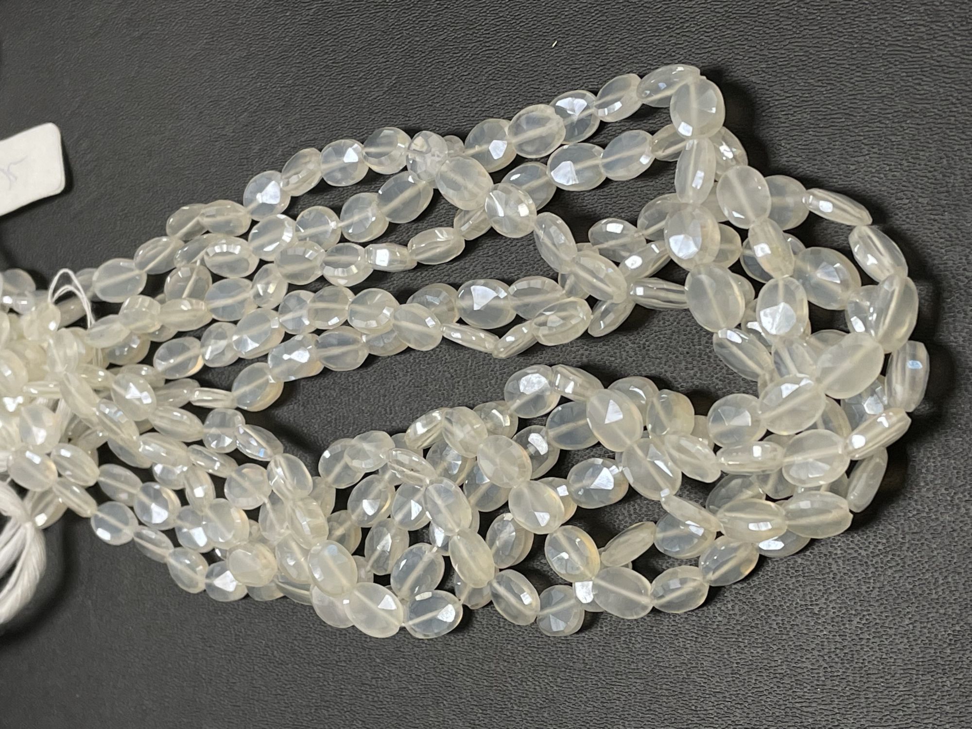 Coated Pearl White Chalcedony Oval Faceted