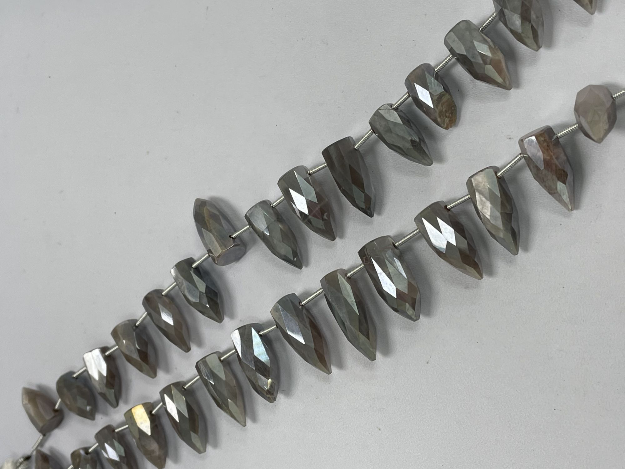 Coated Moonstone Bullet Faceted