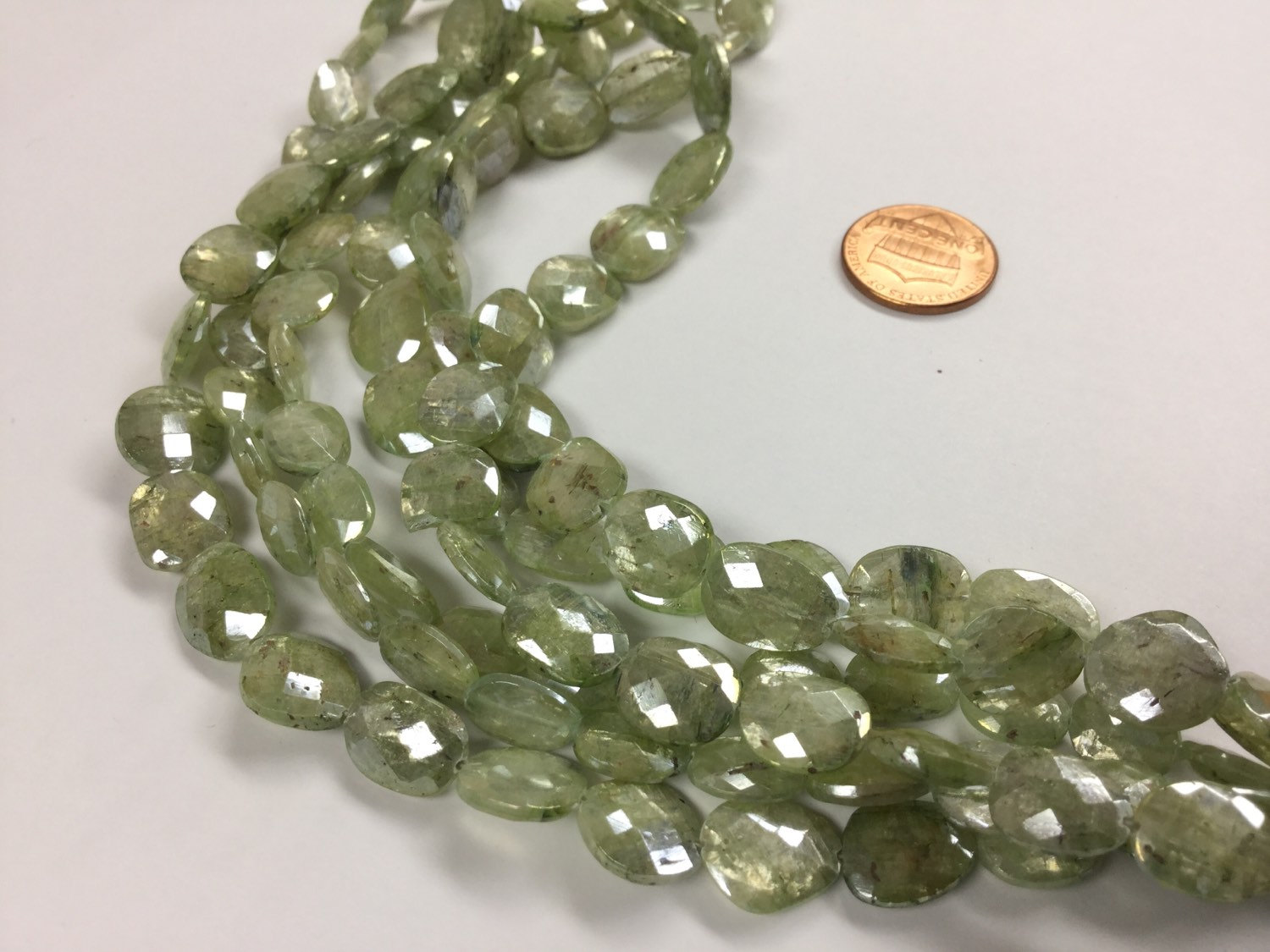 Coated Green Kyanite Ovals Faceted