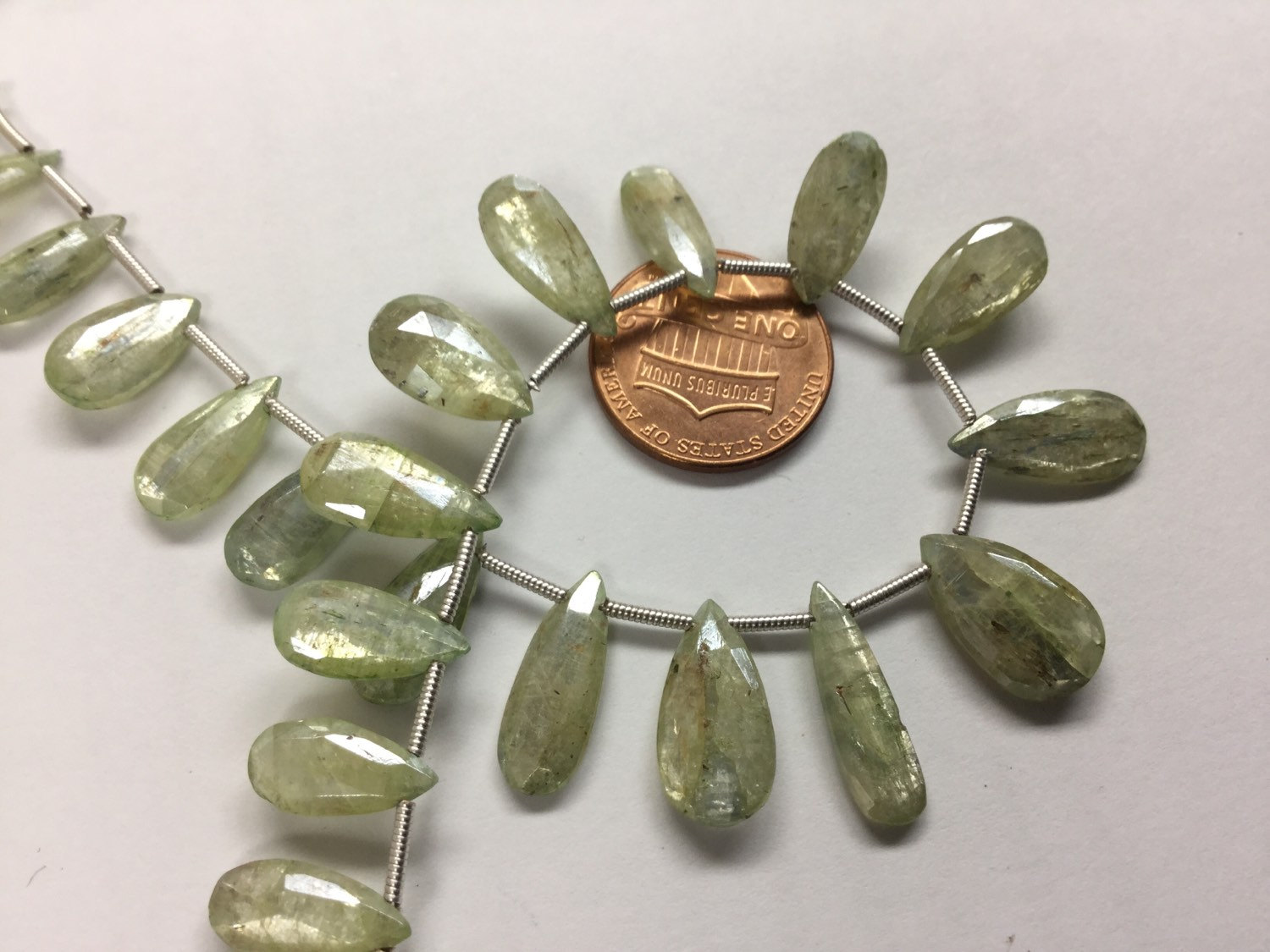 Coated Green Kyanite Pears Faceted