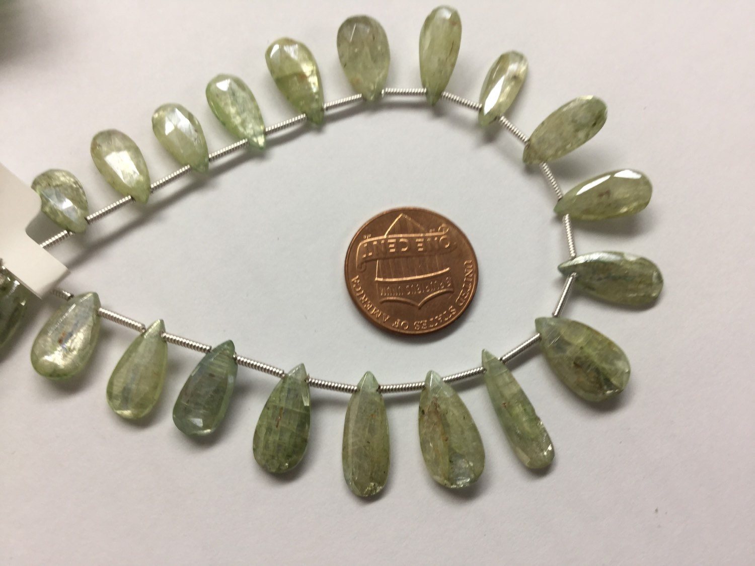 Coated Green Kyanite Pears Faceted