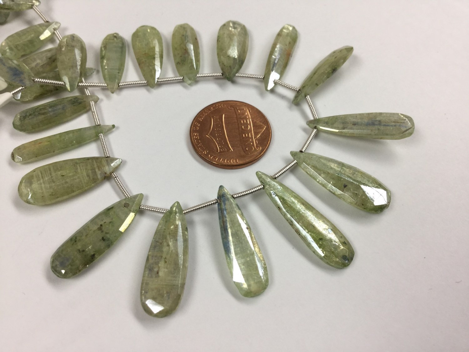 Coated Green Kyanite Pears Faceted