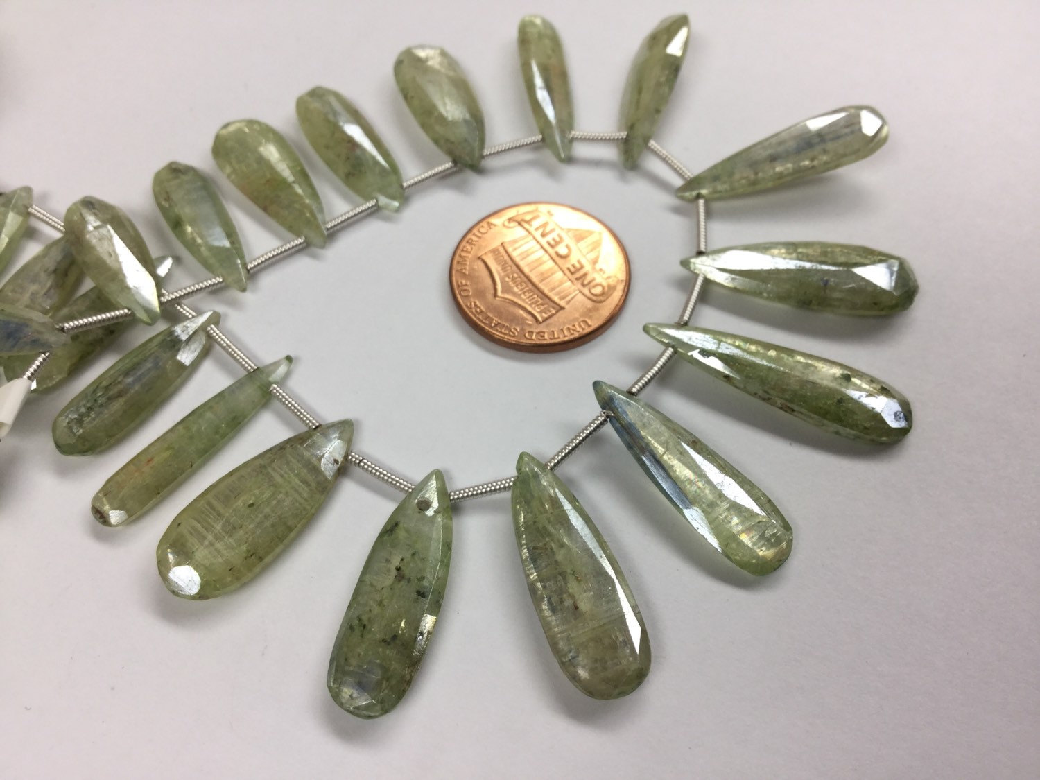 Coated Green Kyanite Pears Faceted