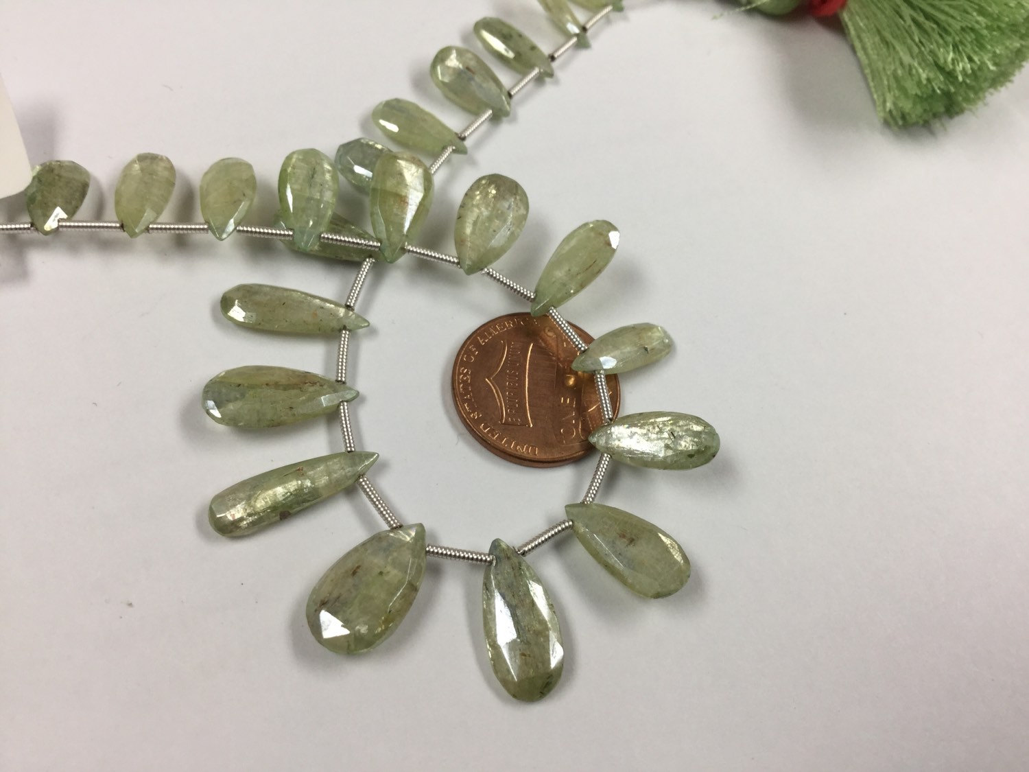 Coated Green Kyanite Pears Faceted