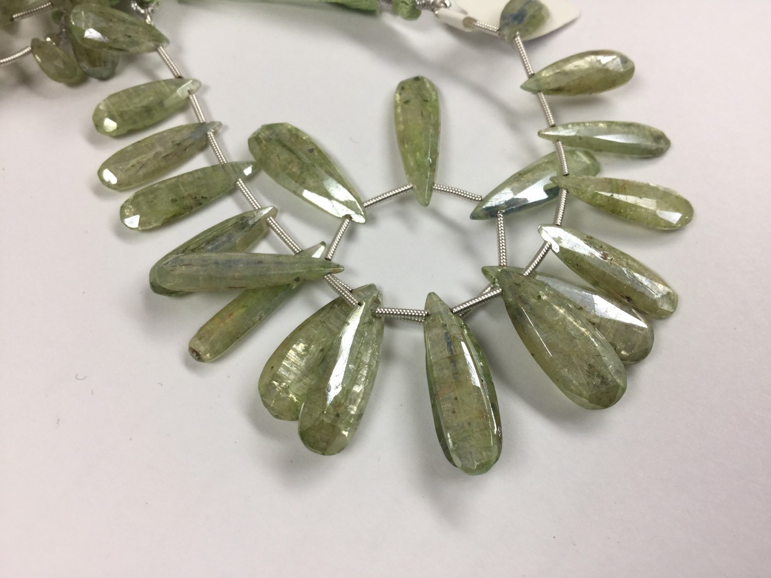 Coated Green Kyanite Pears Faceted