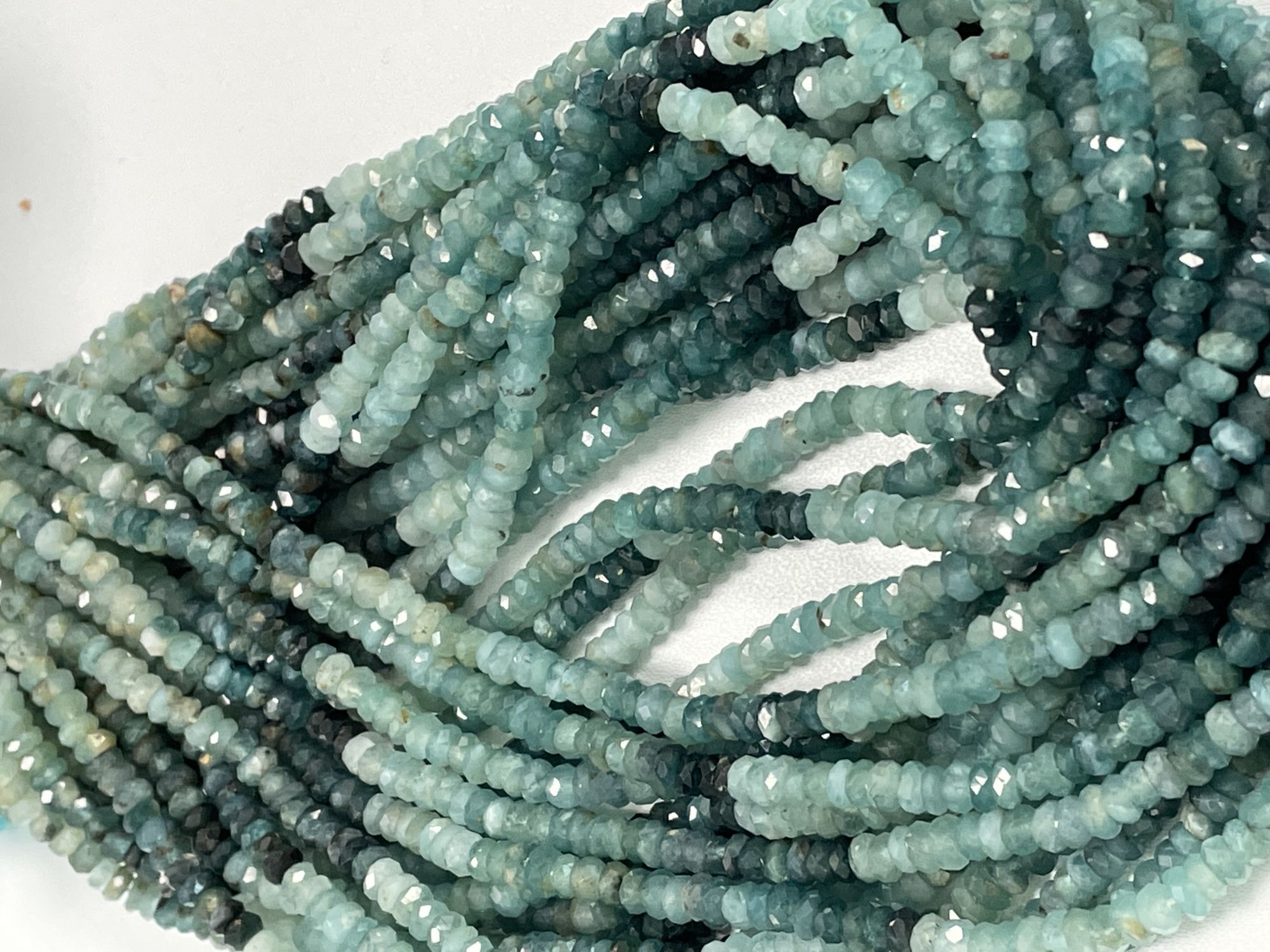 Shaeded Grandidierite Rondelle Faceted