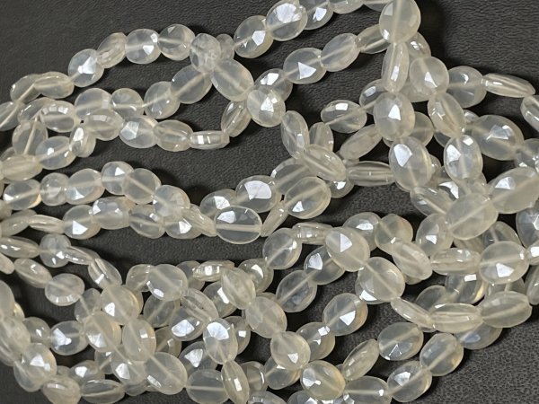 Coated Pearl White Chalcedony Oval Faceted