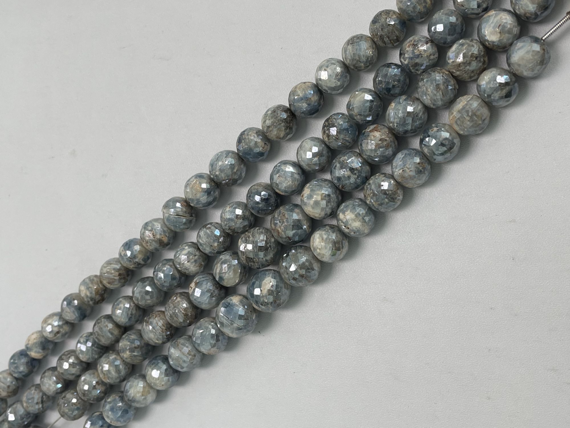 Coated Blue Kyanite Round Faceted