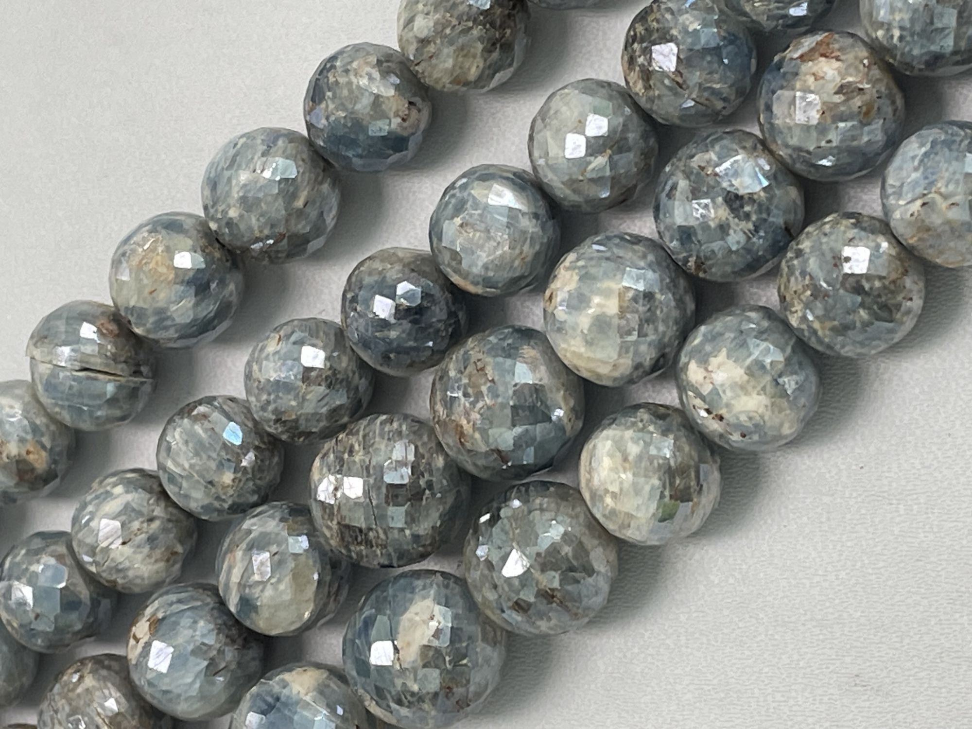 Coated Blue Kyanite Round Faceted