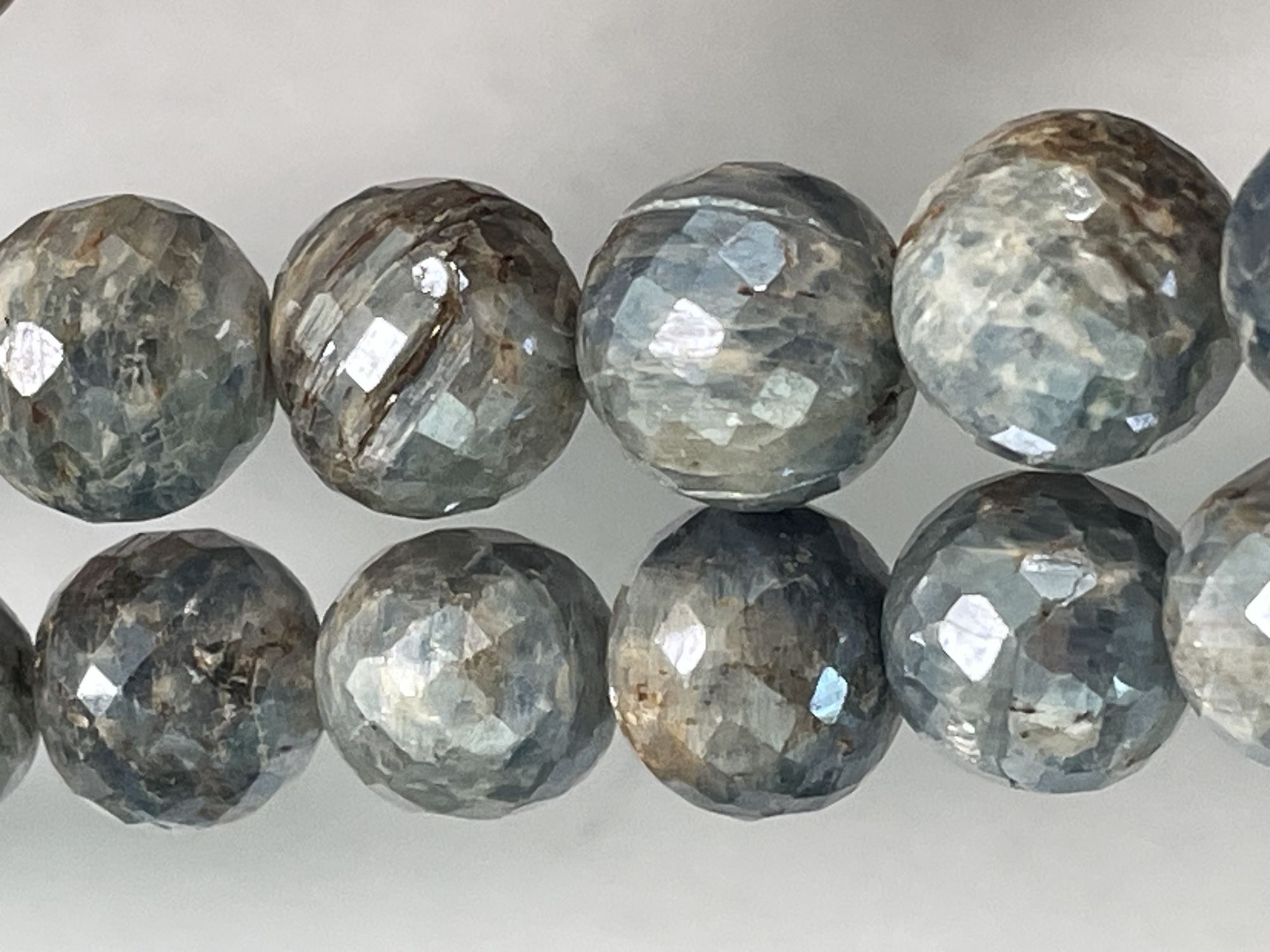 Coated Blue Kyanite Round Faceted