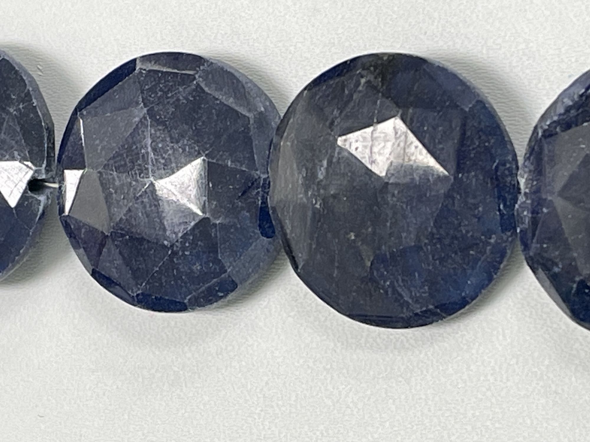 Oiled Blue Sapphire Coin Faceted