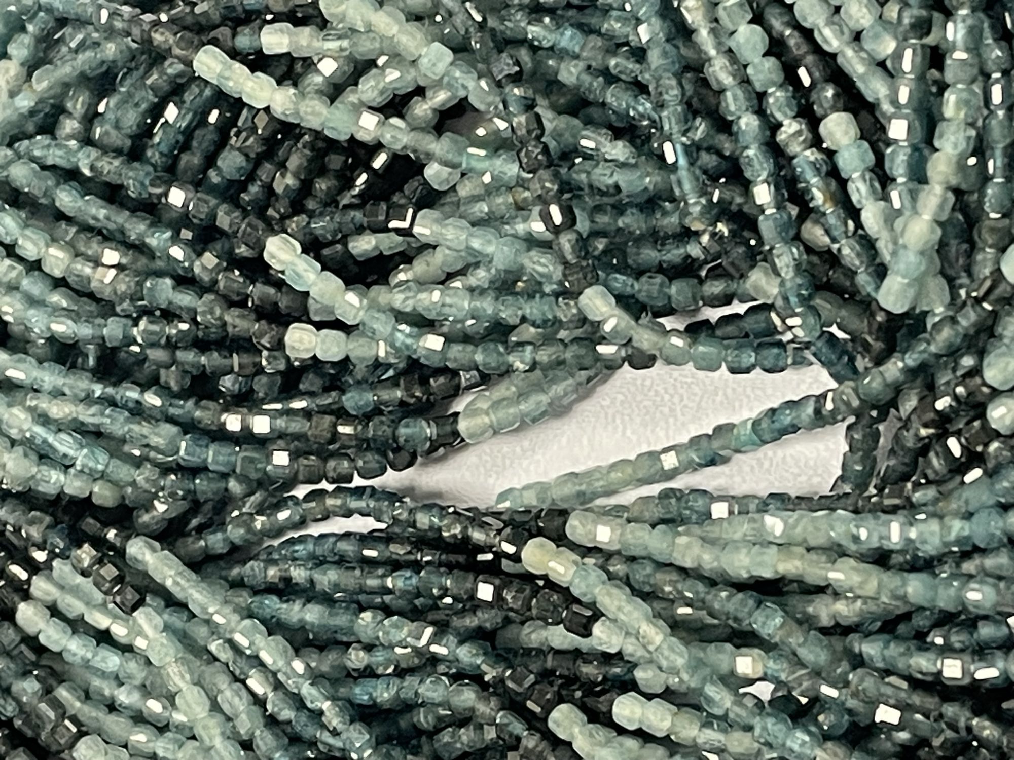 Shaded Grey Grandidierite Cube Faceted