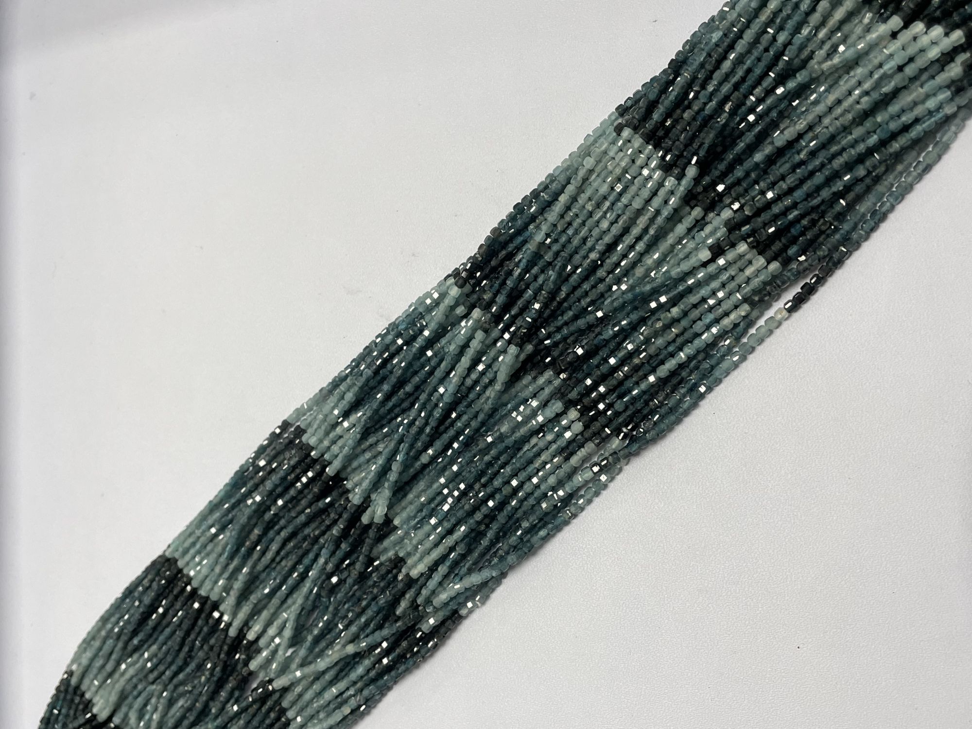 Shaded Grey Grandidierite Cube Faceted