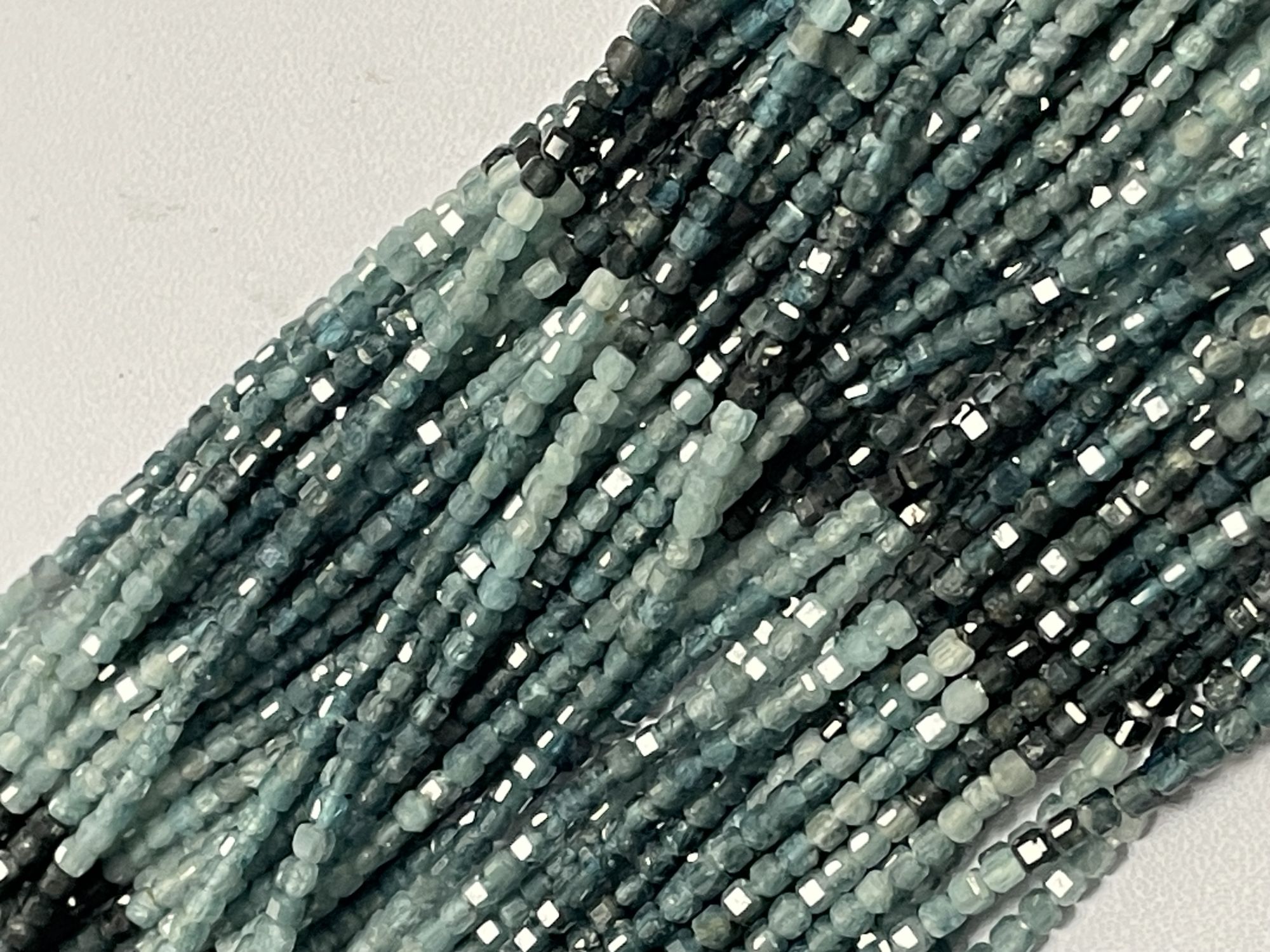 Shaded Grey Grandidierite Cube Faceted