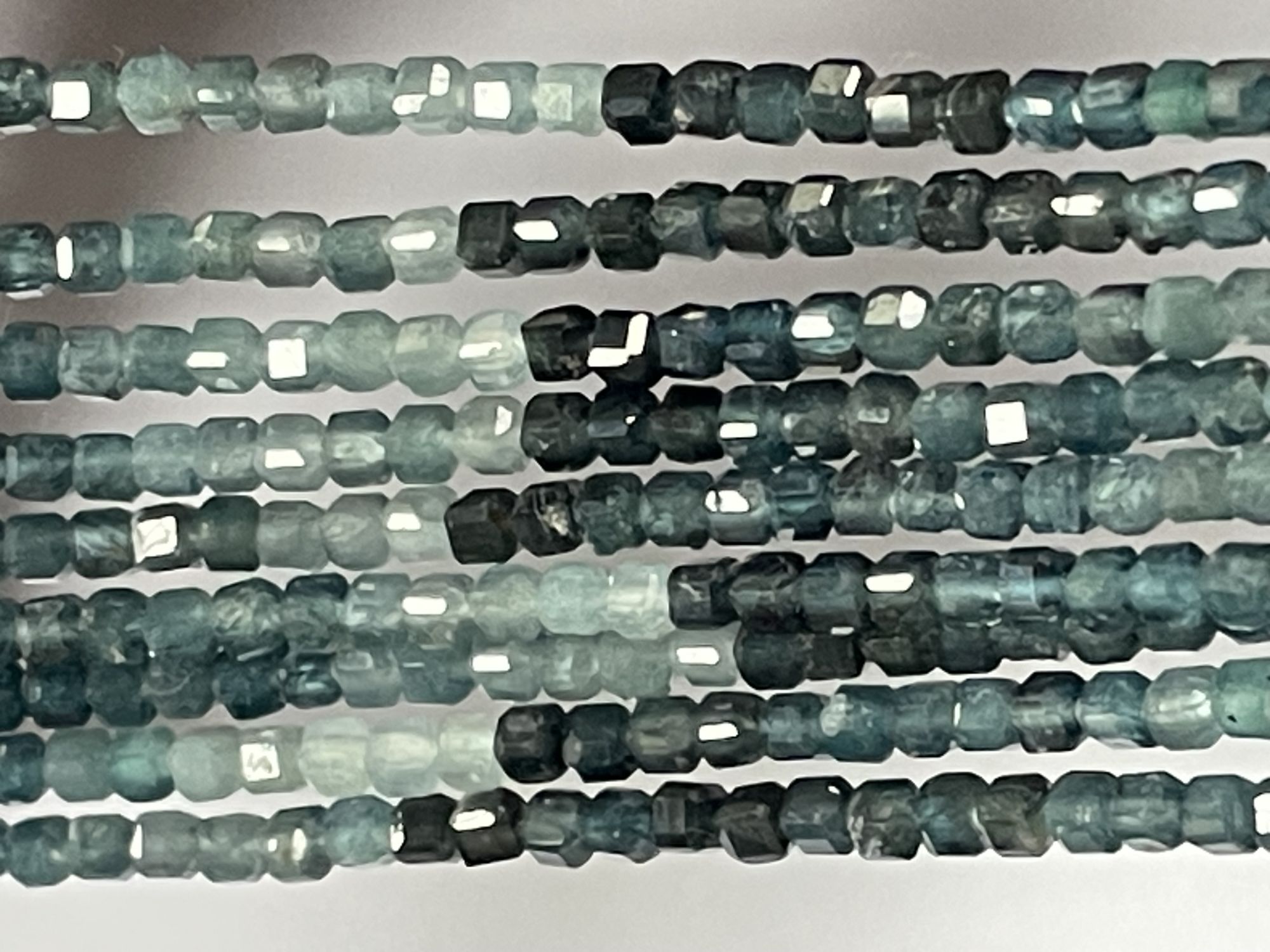 Shaded Grey Grandidierite Cube Faceted