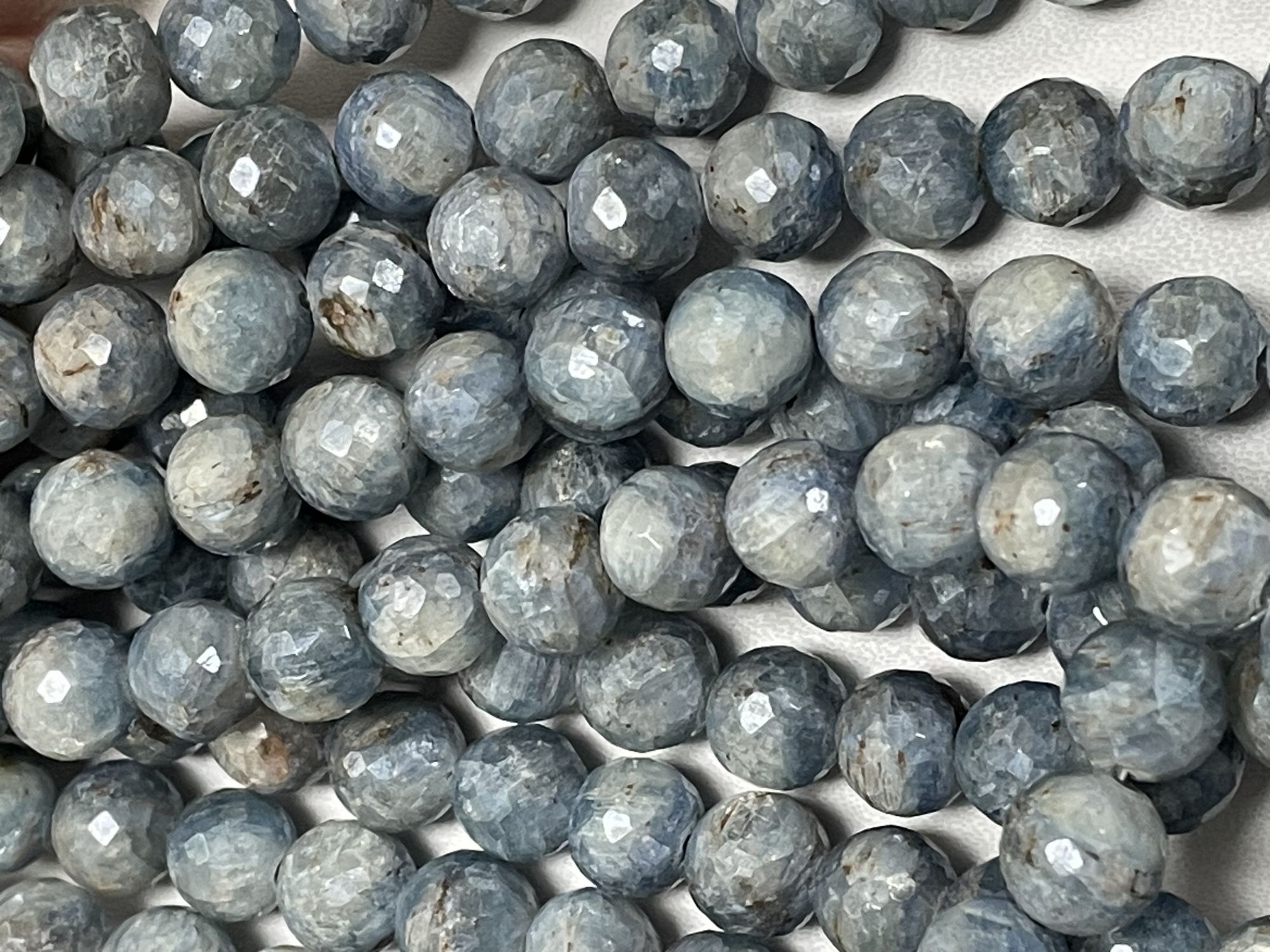 Coated Kyanite Round Faceted