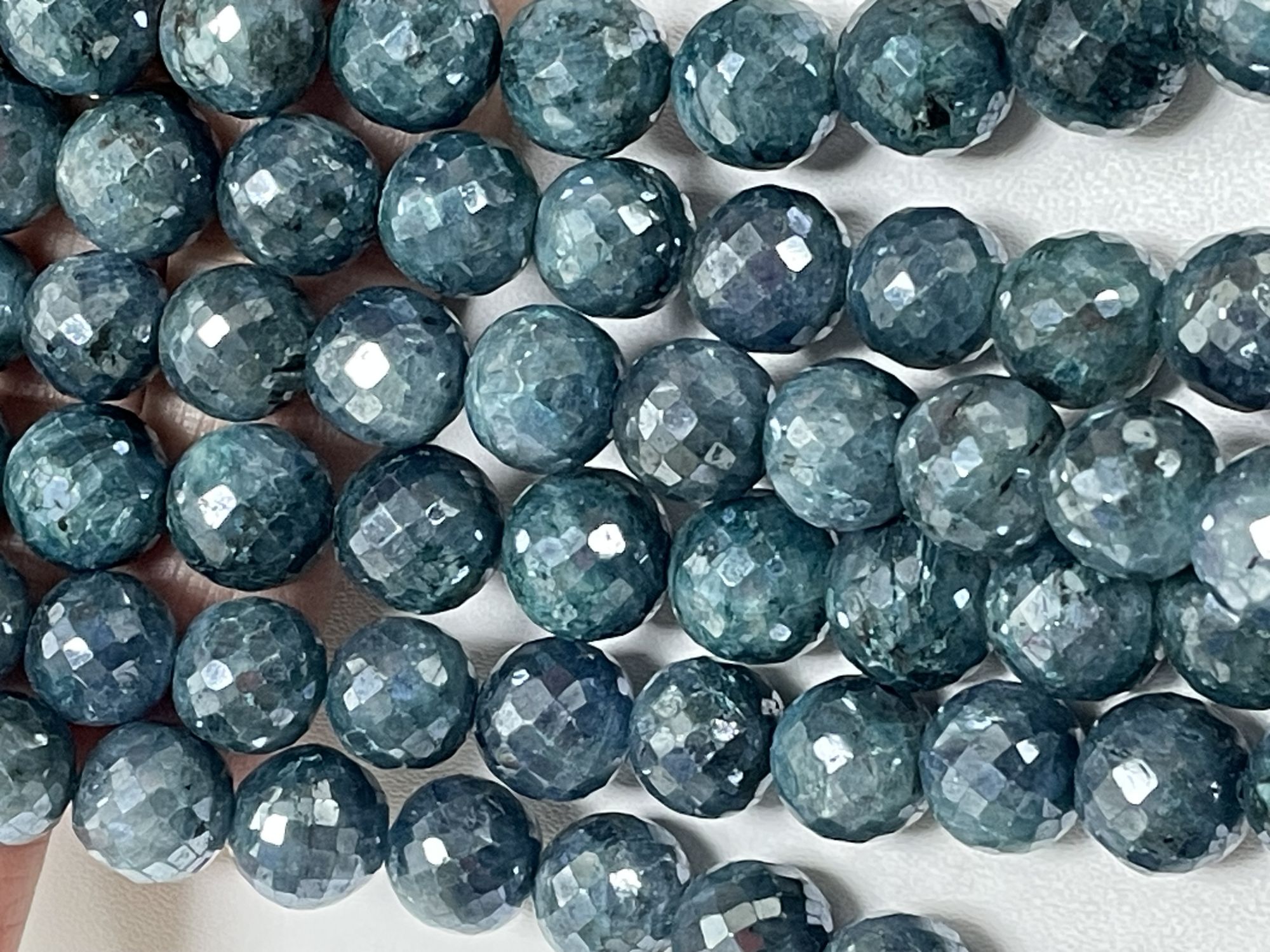 Coated Kyanite Round Faceted