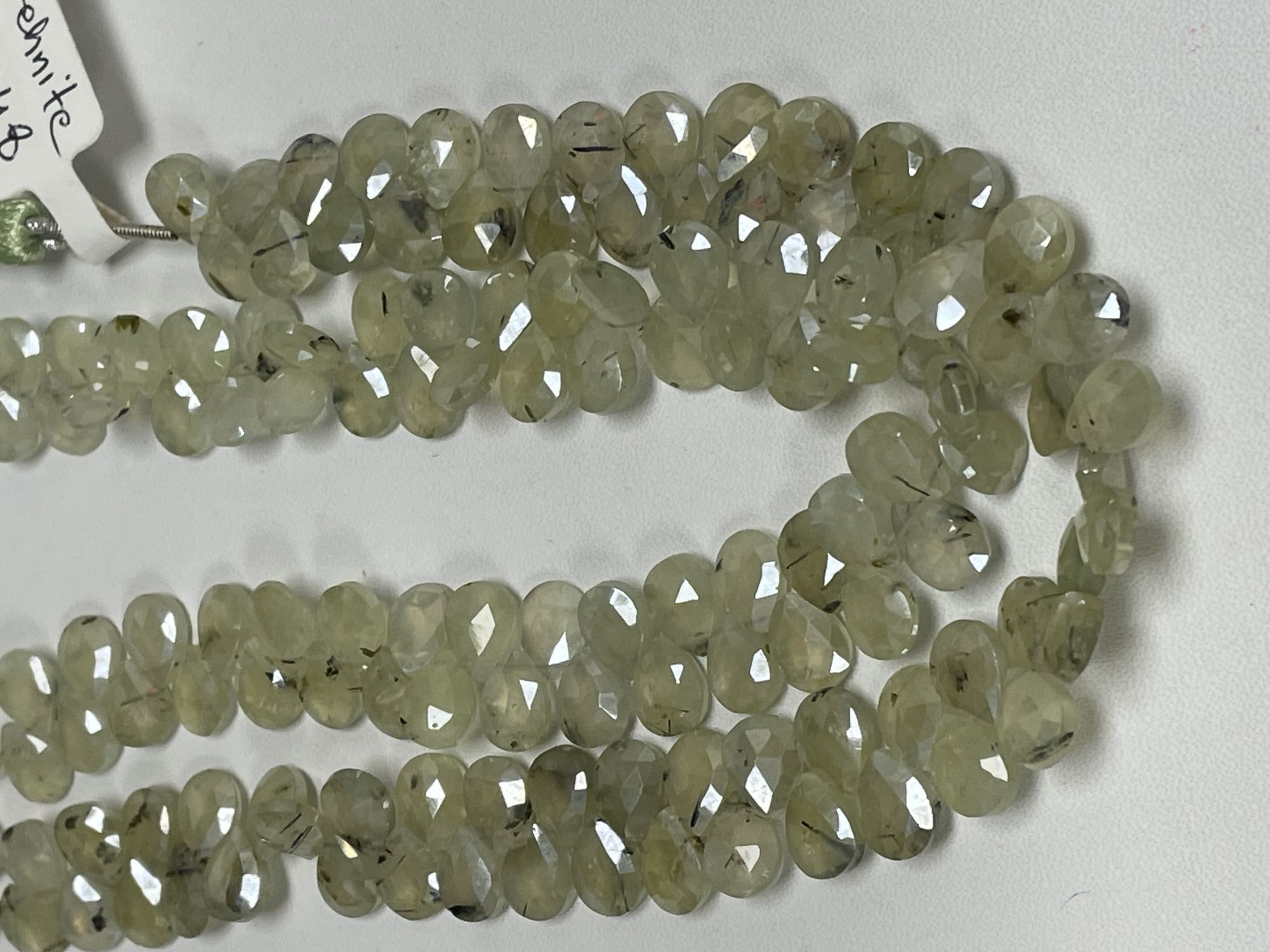 Coated Prehnite Pear Faceted