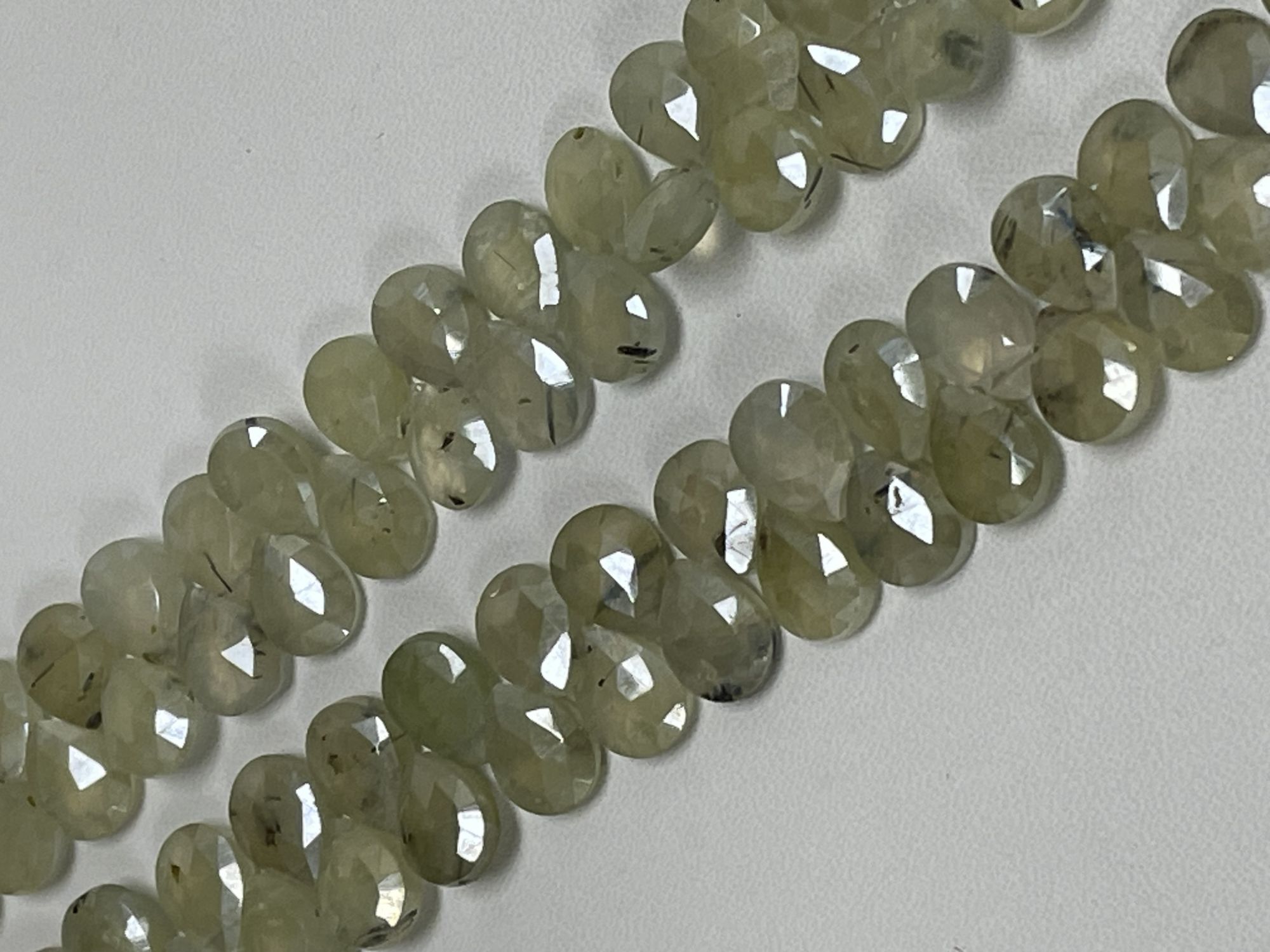 Coated Prehnite Pear Faceted