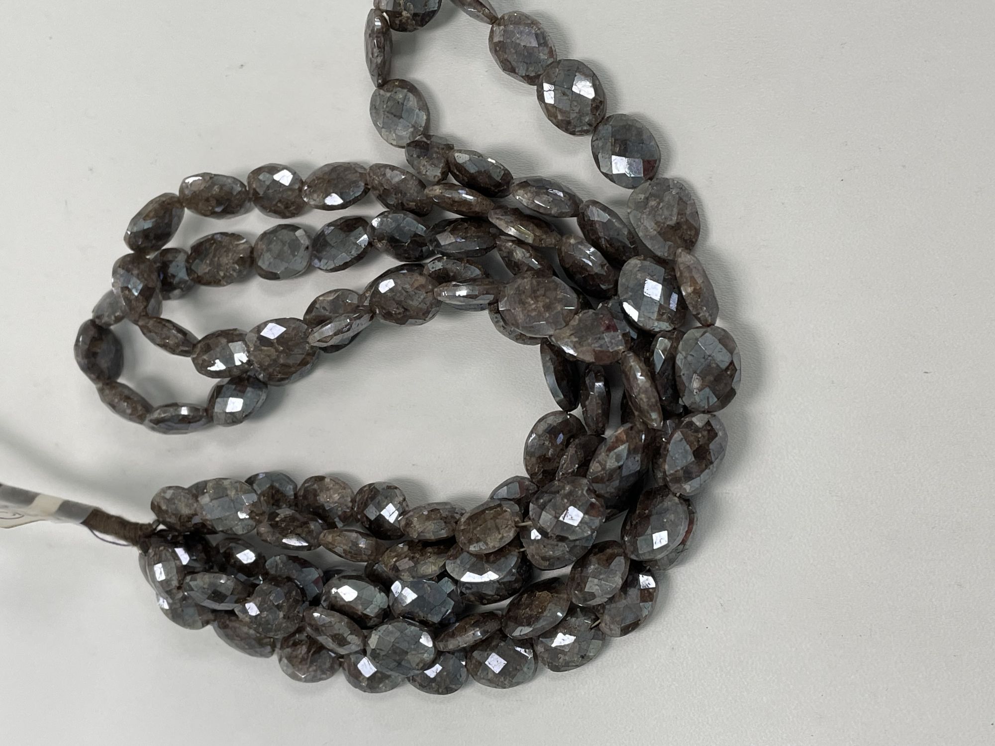 Coated Brown Silverite Oval Faceted