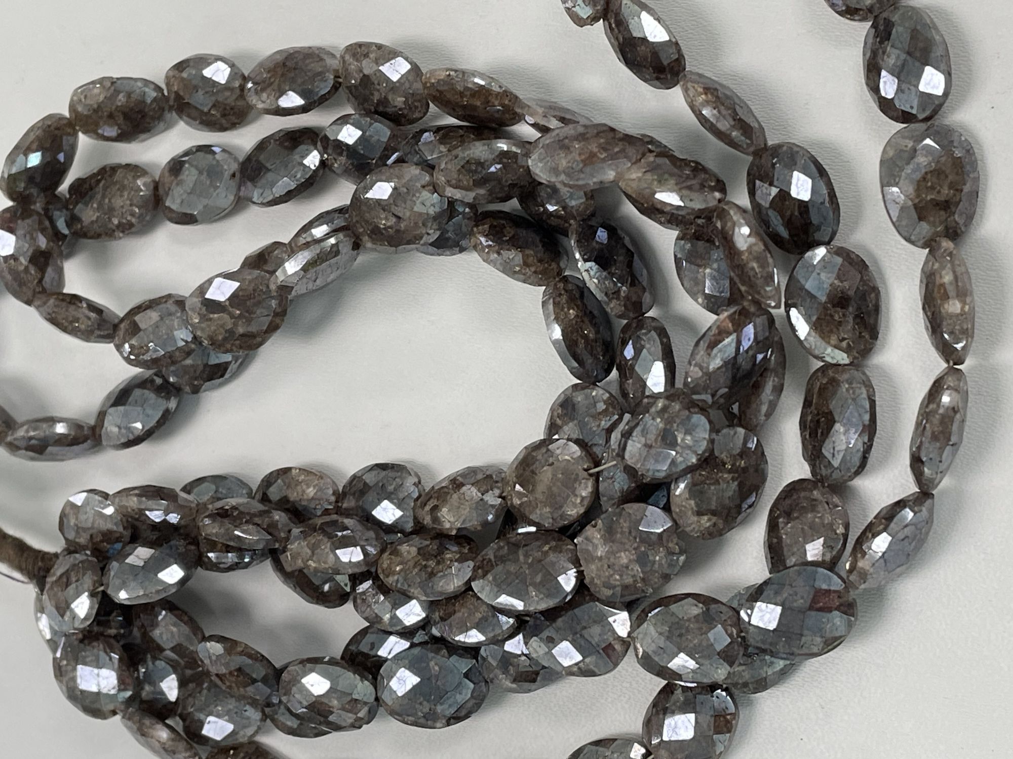 Coated Brown Silverite Oval Faceted