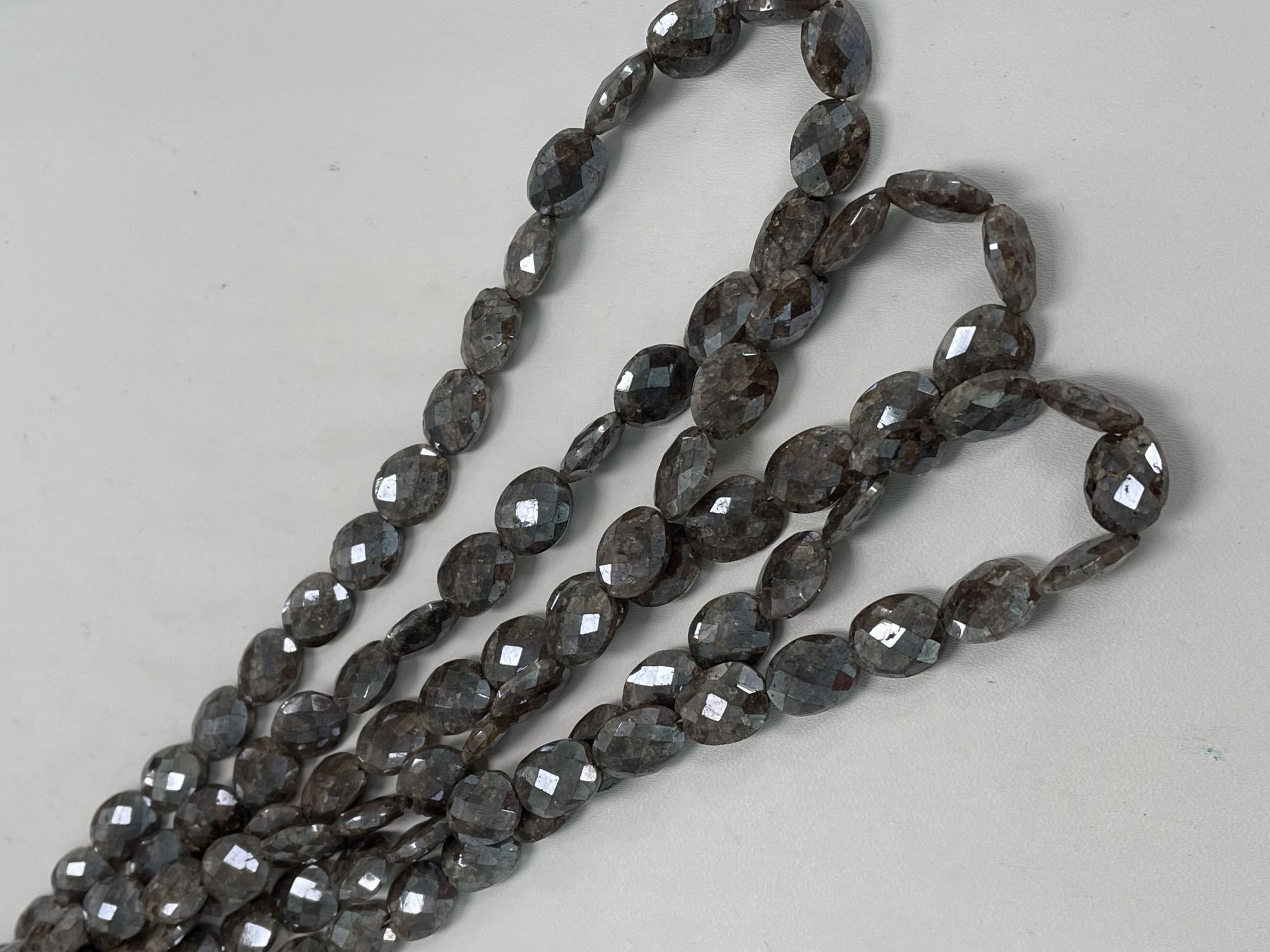 Coated Brown Silverite Oval Faceted