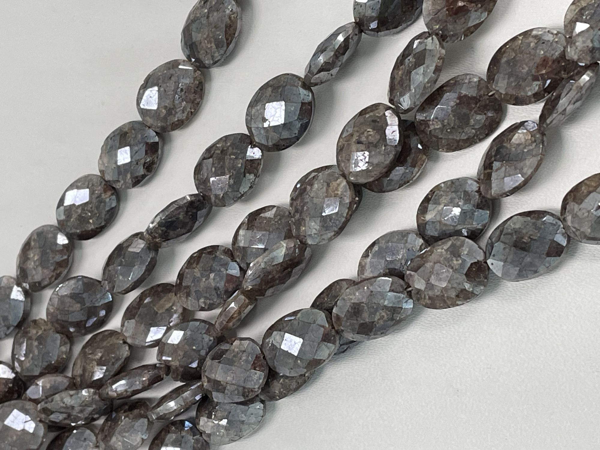 Coated Brown Silverite Oval Faceted