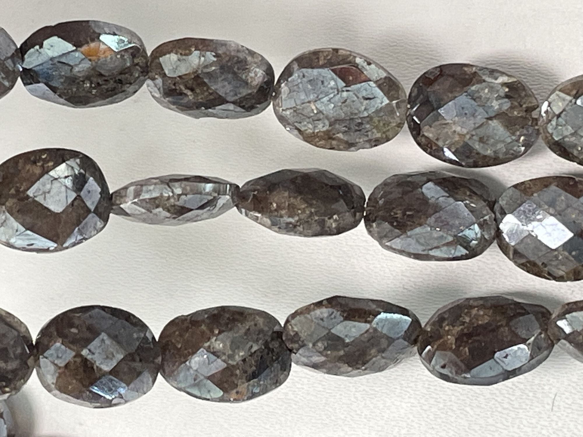 Coated Brown Silverite Oval Faceted