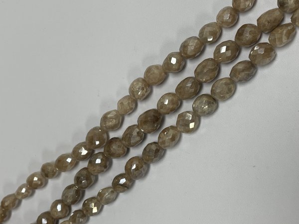 Coated Brown Grapolite Oval Faceted