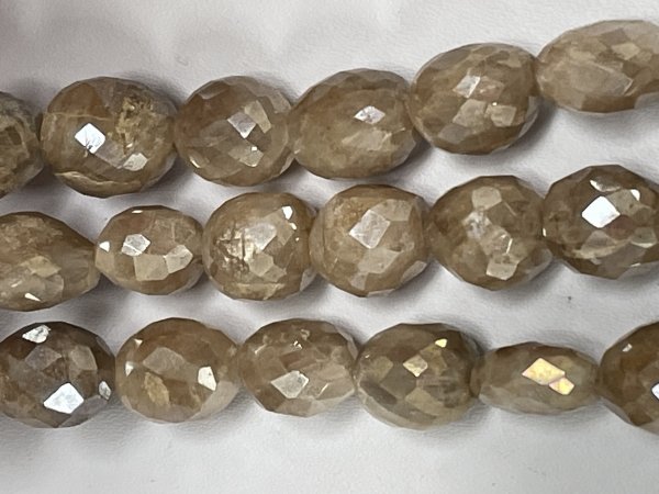 Coated Brown Grapolite Oval Faceted