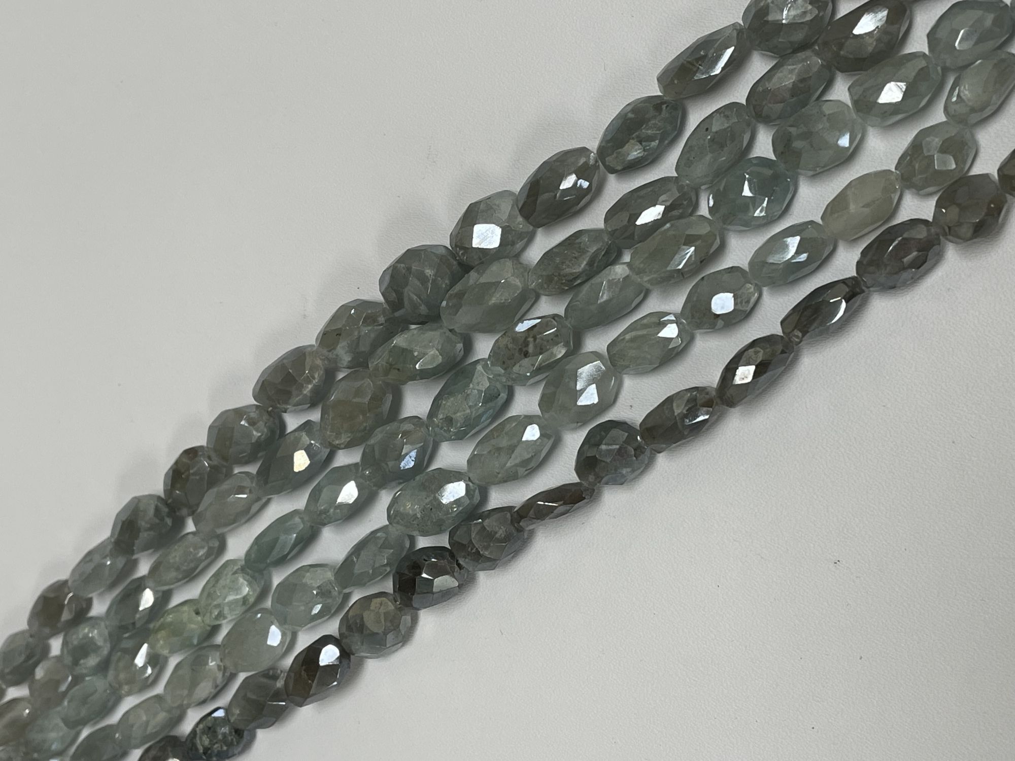 Coated Aquamarine Oval Faceted