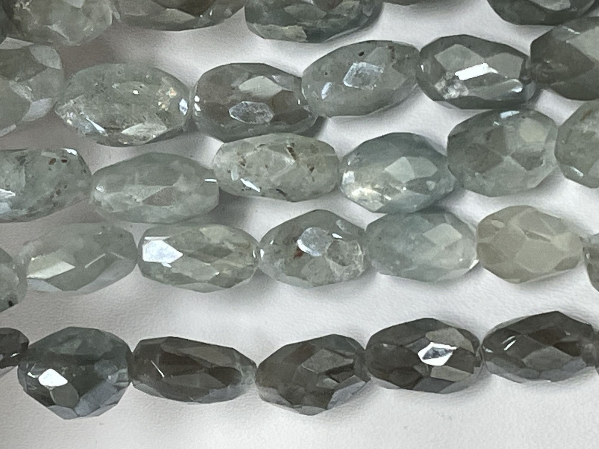 Coated Aquamarine Oval Faceted